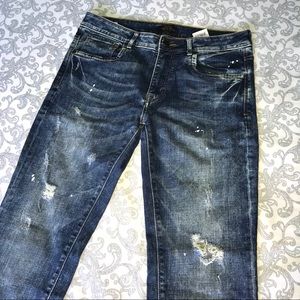 Slim fit jeans (with rips and paint splatter)